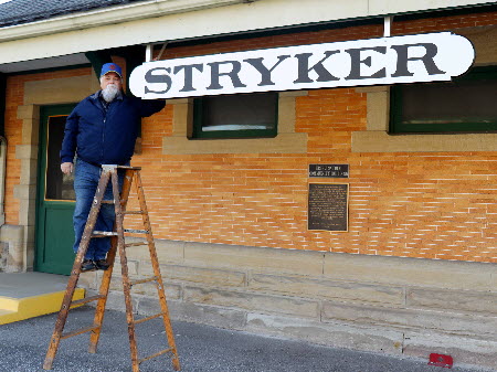 Stryker depot front with Bruce Zigler next to Stryker sign Dec 2020 Stryker depot front with Bruce Zigler next to Stryker sign Dec 2020